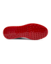 Straight Down Defender Golf Shoe in Camo Ocean, bottom sole view featuring solid red mixed traction outsole with hexagonal and triangular lugs, white midsole edge, and white arch bridge