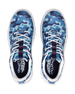 Straight Down Defender Golf Shoe in Camo Ocean, top-down view of pair featuring blue tonal camouflage print upper, navy tongue pull tab with red accent stitching, white laces, and navy Straight Down wing logo insole
