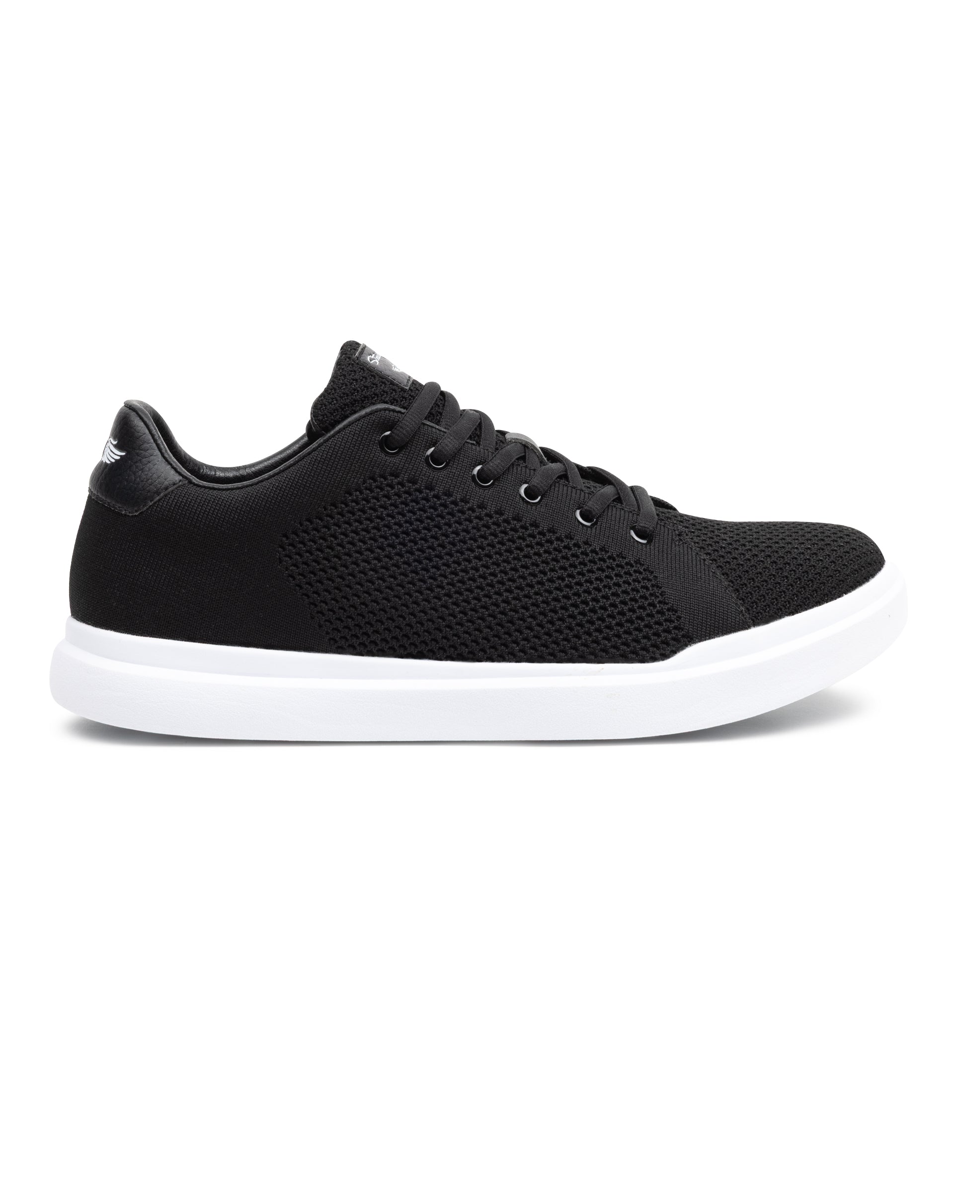 Black sneaker with white sole on a white background