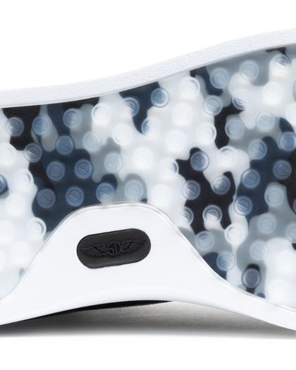 Field V3 Shoes in Black, close-up outsole detail view featuring a black and white camo-patterned rubber traction sole with circular grip nubs and black Straight Down logo detail on the white heel