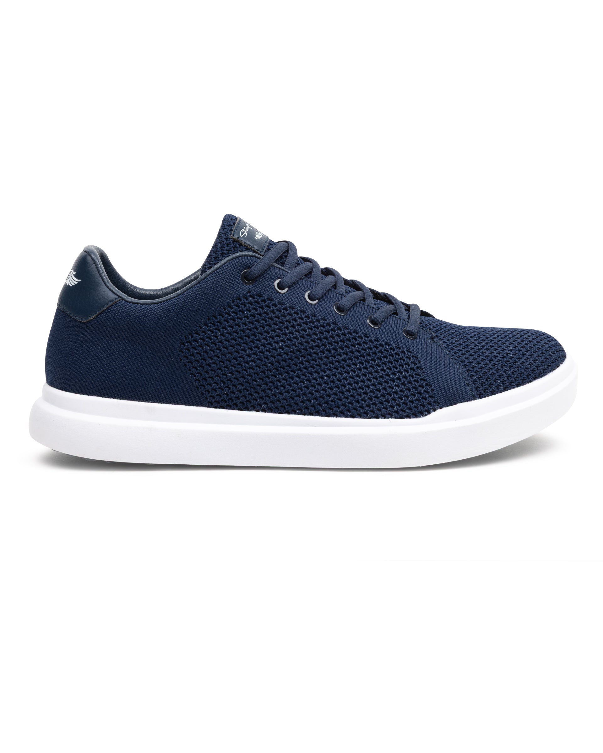 Navy blue sneaker with white sole on a white background