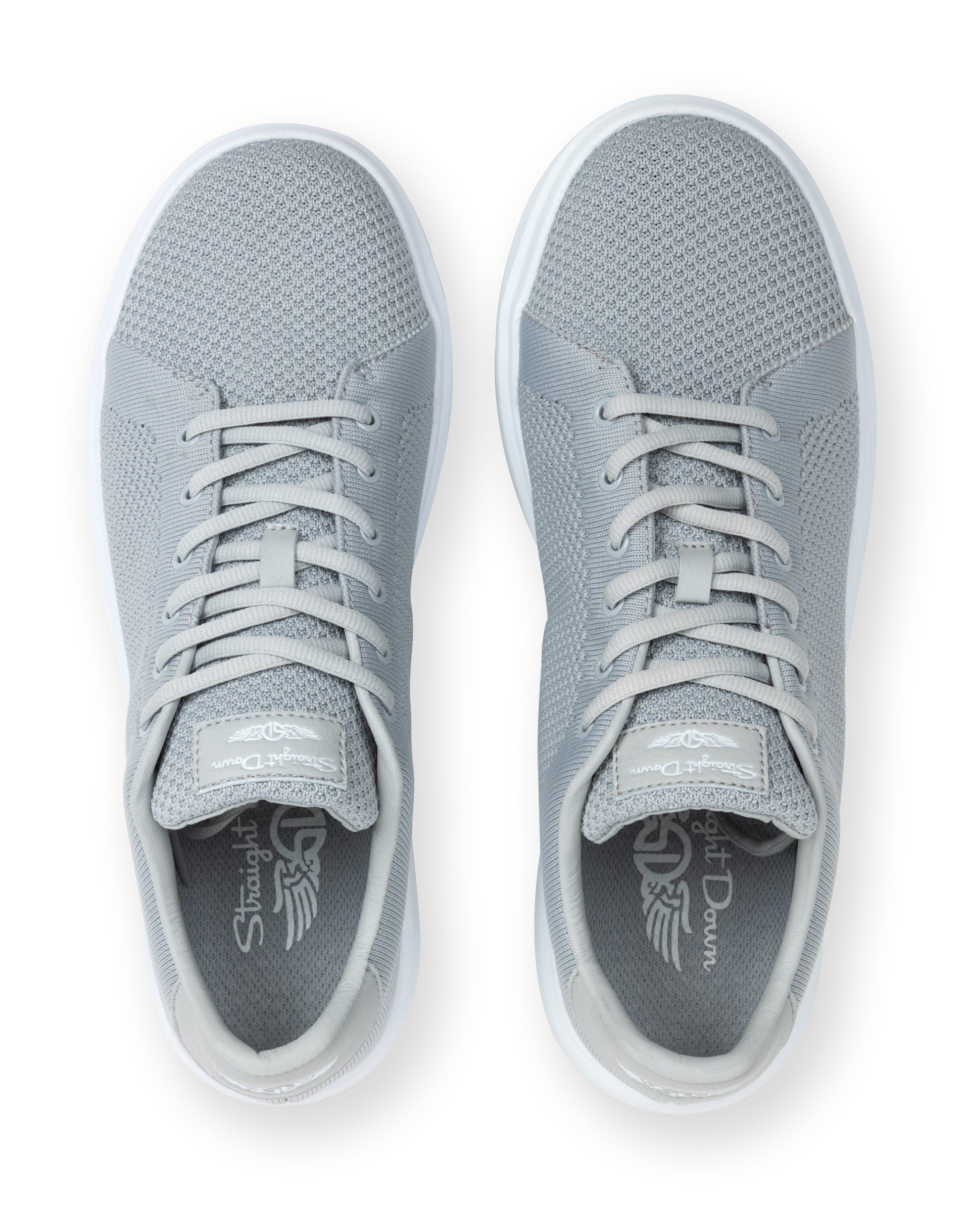 Pair of gray sneakers with a brand logo on a white background