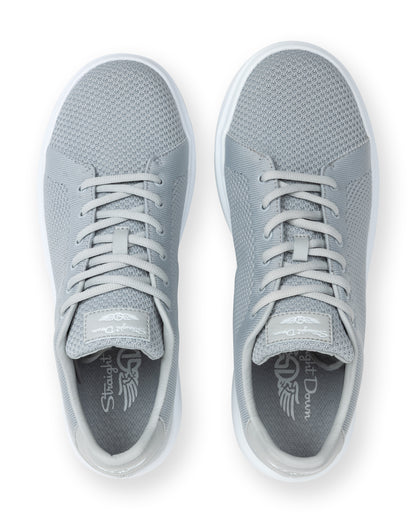 Pair of gray sneakers with a brand logo on a white background