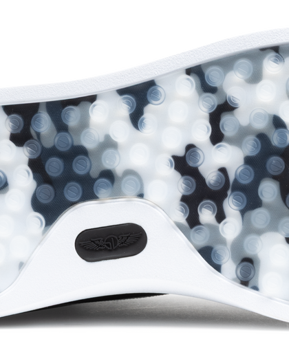 Field V3 Shoes in Black, close-up outsole detail view featuring a black and white camo-patterned rubber traction sole with circular grip nubs and black Straight Down logo detail on the white heel