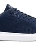 Navy blue sneaker with white sole on a white background