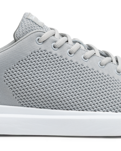 Field V3 Shoes in Silver, close-up side view featuring a light gray knit mesh upper with textured woven pattern, gray lace-up closure, and white midsole