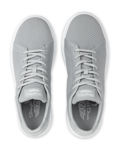 Pair of silver sneakers with a brand logo on a white background