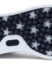 Close-up of a shoe sole with star pattern and brand logo