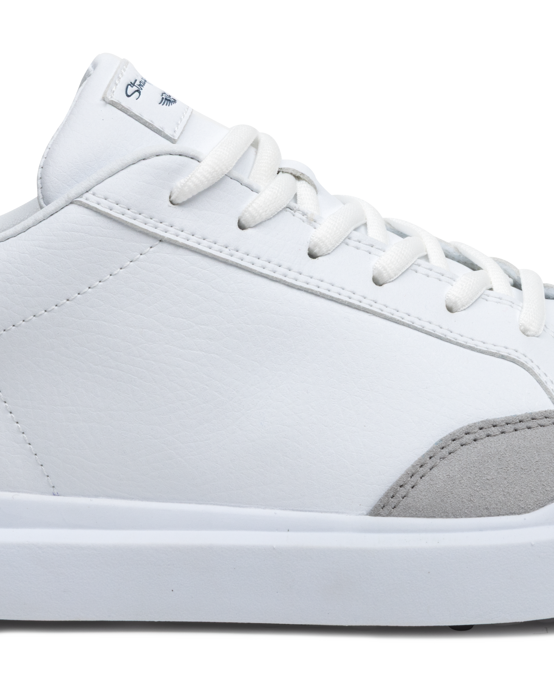 Cruise Shoes in White, close-up side view featuring a white leather upper with light gray suede heel accent, white lace-up closure, and Straight Down logo tongue tab detail on a white midsole