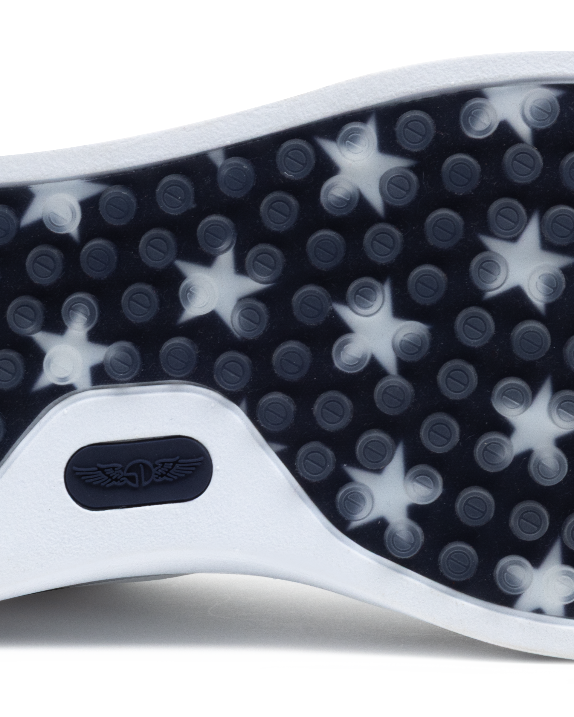 Close-up of a shoe sole with star pattern and brand logo