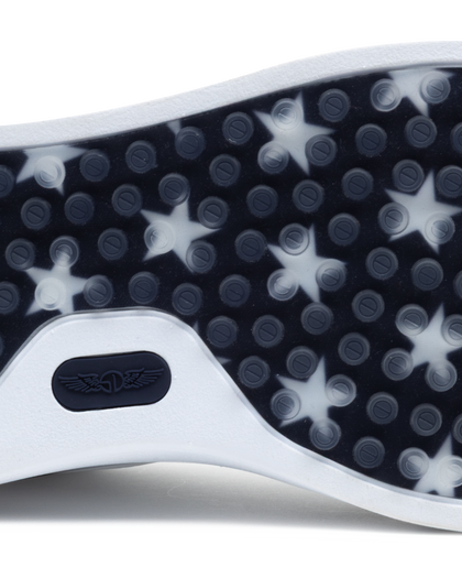 Close-up of a shoe sole with star pattern and brand logo