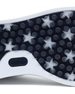 Close-up of a shoe sole with star pattern and brand logo