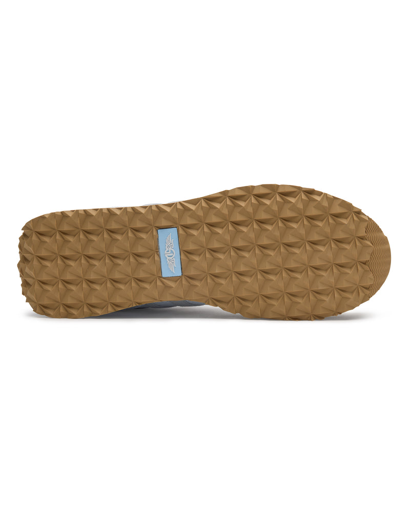 Clubhouse Trainer with white body, red and blue accents, outsole view
