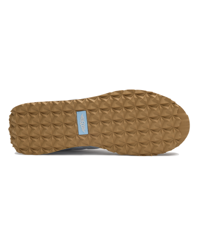 Clubhouse Trainer with white body, red and blue accents, outsole view