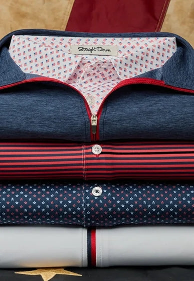 Stacked America 250 Collection golf apparel featuring a quarter zip, geometric print polo, striped polo in patriotic red, white, and blue colorways