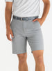 Men's Drake Short in Carbon, front model view featuring a flat-front silhouette in a cool medium gray colorway, styled with a gray belt and gray polo