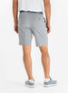 Men's Drake Short in Carbon, back model view featuring button-welt back pockets with tonal logo detail in a cool medium gray colorway