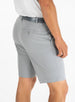 Men's Drake Short in Carbon, side-back model view featuring button-welt back pocket with tonal logo detail in a cool medium gray colorway