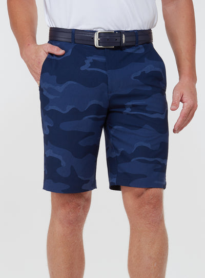 Straight Down Men's Pendleton Short in New Indigo, on model front view showing navy blue camo print with side pockets and navy leather belt paired with a white polo