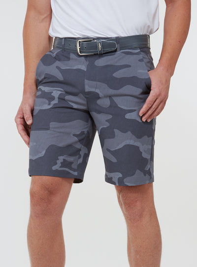 Men's Pendleton Short in Walrus, front view on model featuring a grey and charcoal camouflage print, worn with a grey leather belt and white golf shoes