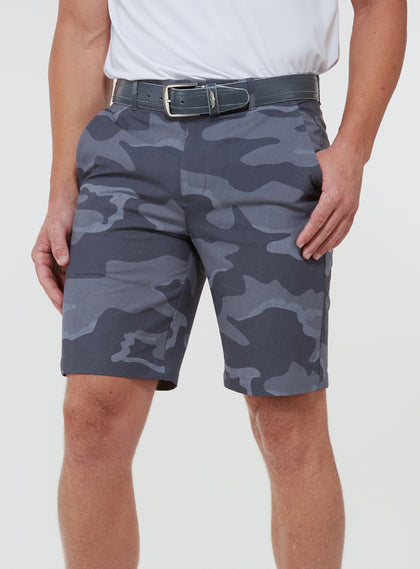 Men's Pendleton Short in Walrus, front view on model featuring a grey and charcoal camouflage print, worn with a grey leather belt and white golf shoes