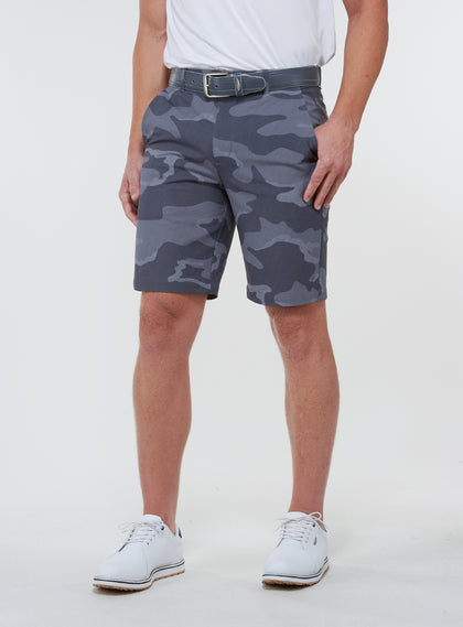Men's Pendleton Short in Walrus, full front view on model featuring a grey and charcoal camouflage print, worn with a grey leather belt and white golf shoes