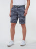 Men's Pendleton Short in Walrus, full front view on model featuring a grey and charcoal camouflage print, worn with a grey leather belt and white golf shoes