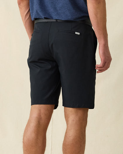 Men's Maverick Twill Short in Black, back view on model showcasing black shorts with back welt pocket and Straight Down logo patch, styled with a blue shirt and black belt