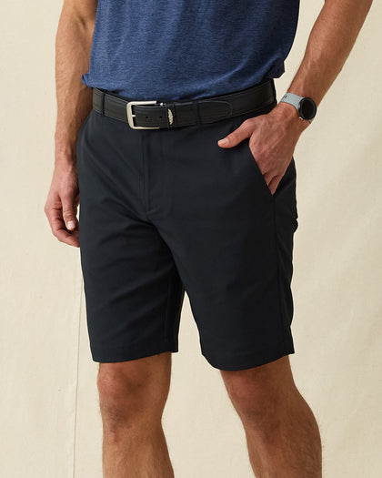 Men's Maverick Twill Short in Black, side view on model featuring black shorts with side pockets, styled with a blue shirt and black belt