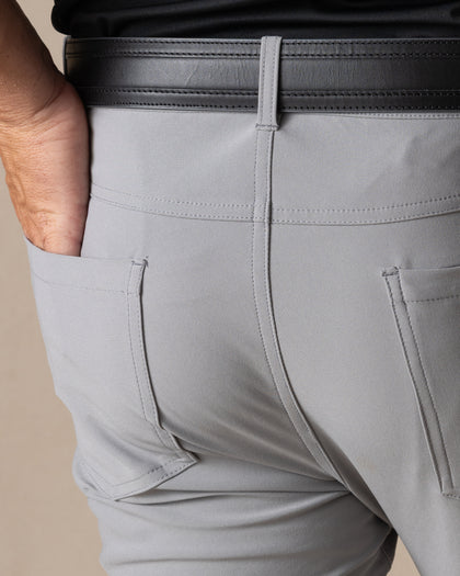 Hero Pant in carbon grey, hand in back pocket detail view