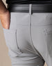 Hero Pant in carbon grey, hand in back pocket detail view