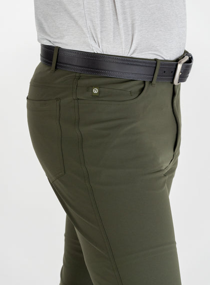 Hero Pant in olive green, front pocket and logo tab detail view