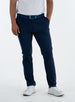 Men's Quest Pant in Indigo, front on-model view featuring navy pants with a button waistband closure and side pockets, styled with a white shirt and white shoes