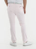 Men's Quest Pant in Light Pink, back on-model view featuring light pink pants with button-closure back pockets and a small logo tab, styled with a white polo, gray belt, and white shoes