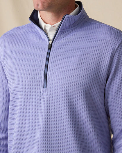 Front Detail: Close-up of the men’s Optic Quarter Zip in Blue Shade, featuring textured waffle-knit fabric, a contrast interior collar, and quarter-zip closure.