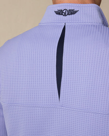 Close-up of the Optic Quarter Zip in Blue Shade featuring the embroidered Straight Down logo and contrast detail at the back collar.