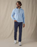 Men’s Optic quarter zip in carolina blue with navy contrast collar, full outfit styled with navy pants