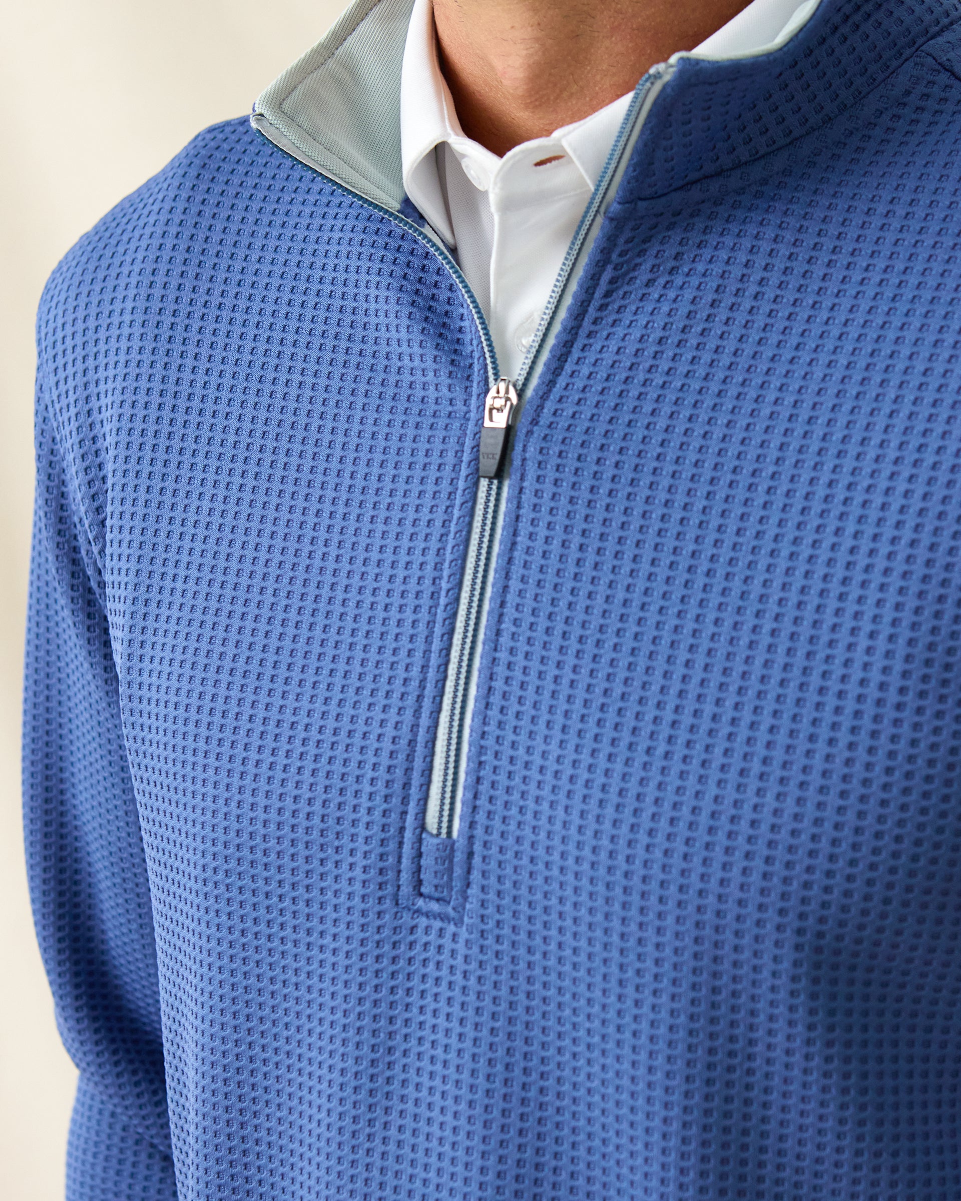 Close-up of Men’s Optic Quarter-Zip in moonlight blue showing textured waffle-knit fabric and quarter-zip collar