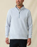 On-model front view of men’s silver Optic Quarter Zip layered over a white polo with navy performance pants