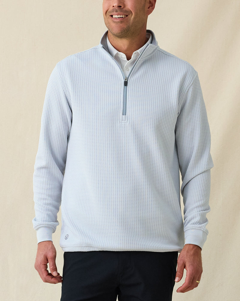 On-model front view of men’s silver Optic Quarter Zip layered over a white polo with navy performance pants