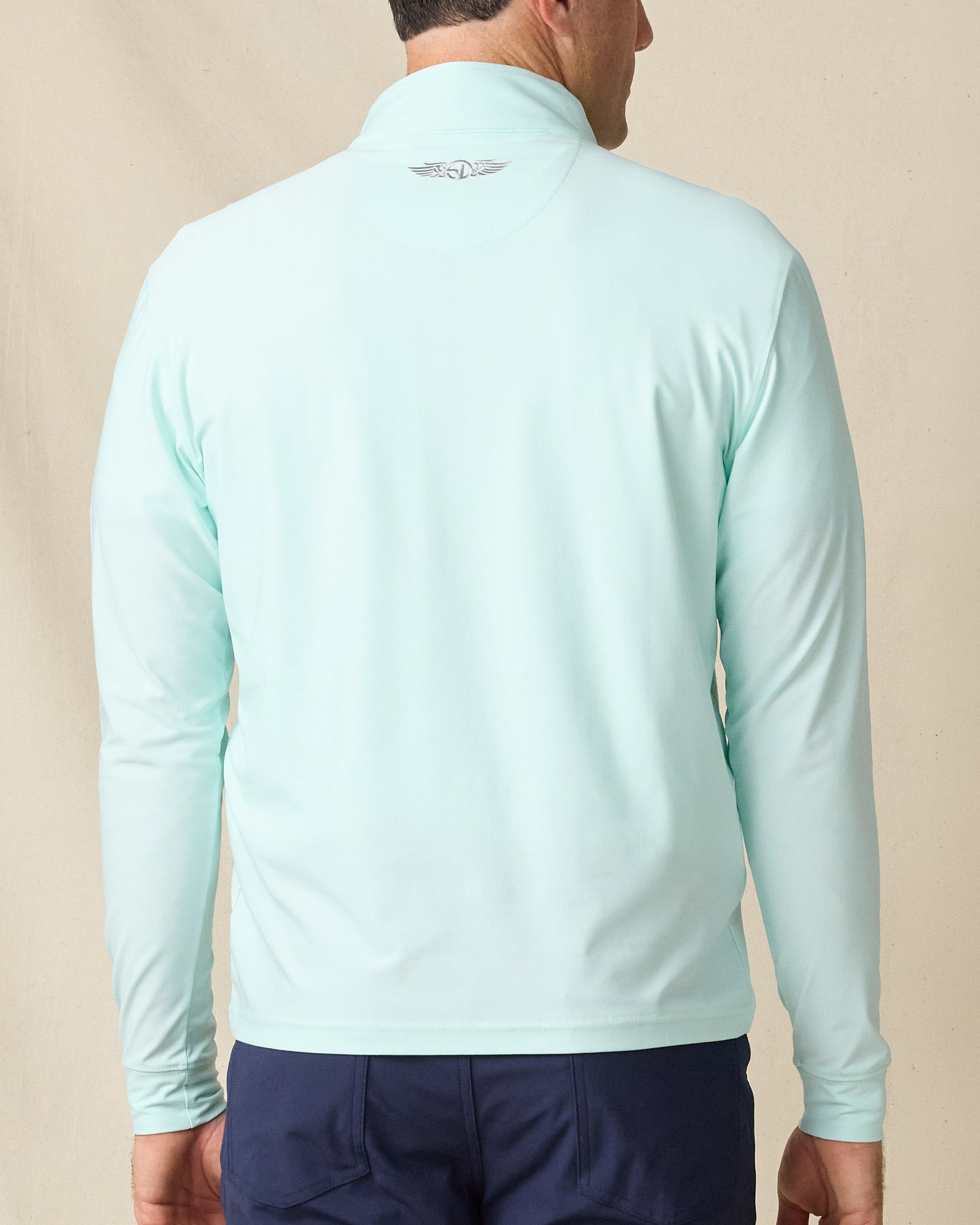 Back view of the Crusher Quarter Zip in Mint Tea, highlighting the streamlined design and embroidered Straight Down logo at the collar.