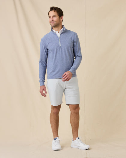 Full-length view of model wearing the Crusher Quarter Zip in Moonlight with light shorts and white sneakers.
Image 5: Close-up o