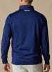 Men's Patton Jacket in Indigo, back on-model view featuring smooth stretch knit fabric with a small embroidered logo at the upper back collar