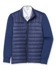 Men's Patton Jacket in Indigo, flat lay front view featuring a solid navy quilted insulated body with knit sleeves, full zip closure, stand collar, and side zip pocket