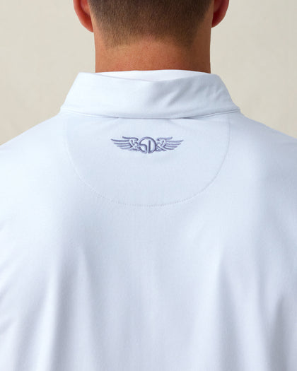 Close-up of the embroidered logo detail just below the collar on the back of the Ballard Quarter Zip in silver