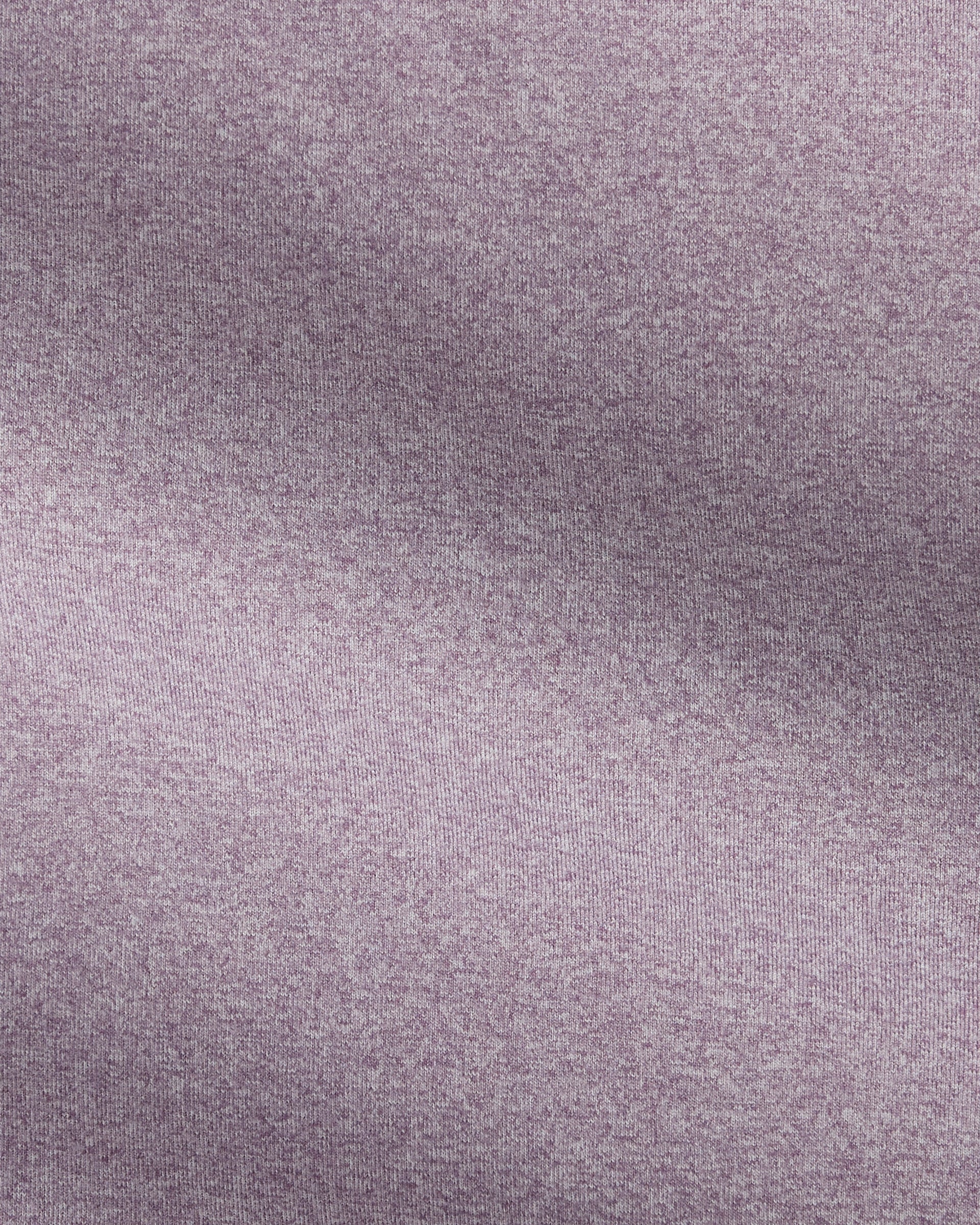A close-up of a textured fabric with a heathered, speckled pattern in a muted dusty lavender-purple color.