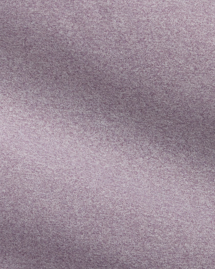 A close-up of a textured fabric with a heathered, speckled pattern in a muted dusty lavender-purple color.