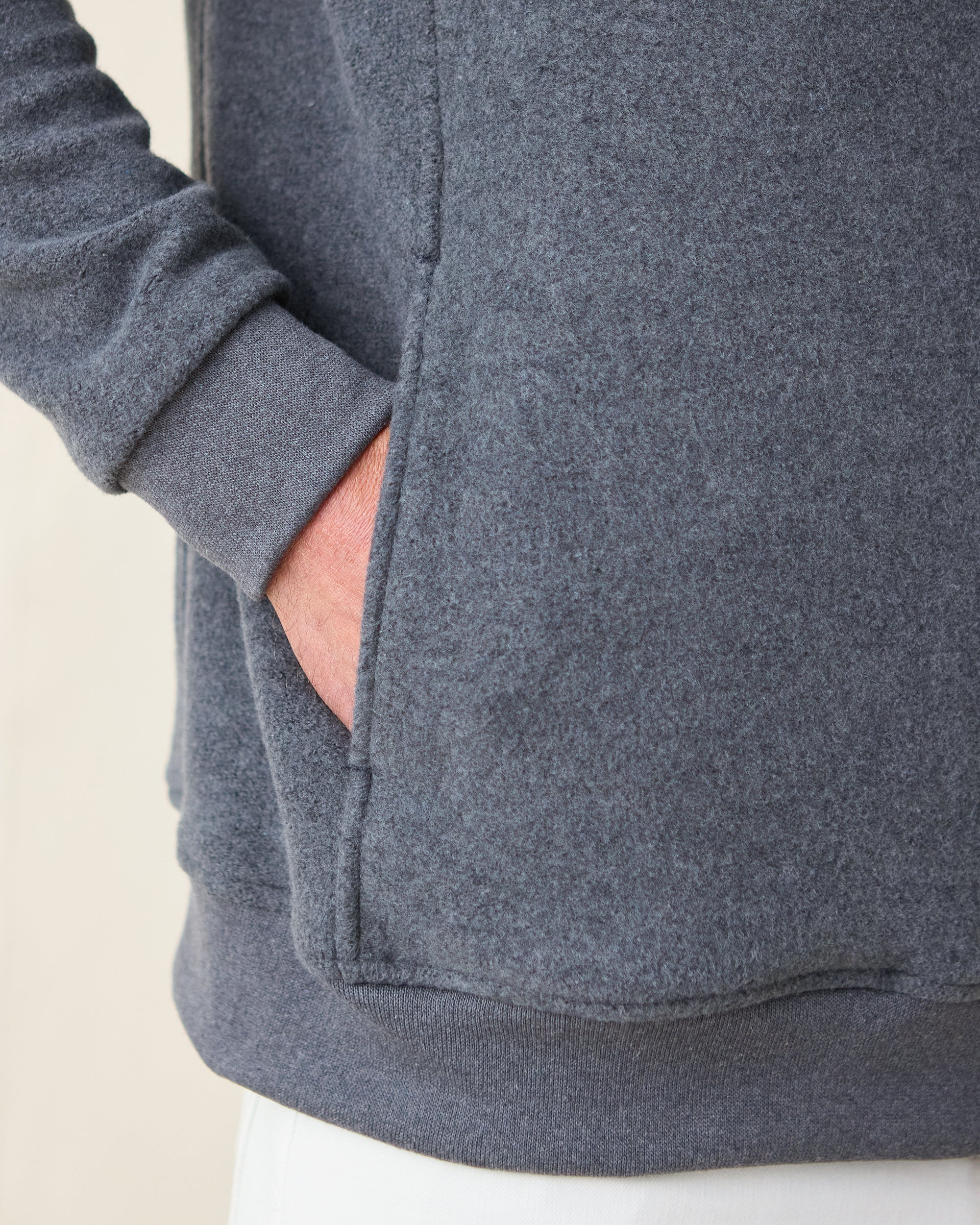 Major Quarter Zip in dark charcoal grey, hand in side pocket detail view