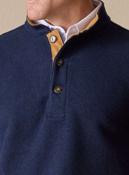 Men's Foothill V2 Placket in Indigo, close-up front detail view featuring navy fleece fabric, three-button placket with gold suede inner placket trim and engraved buttons