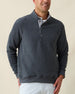 Men's Foothill V2 Placket in Charcoal, front view on model featuring a charcoal heathered fleece pullover with snap button placket and mock collar, styled with a white collared shirt and light grey pants